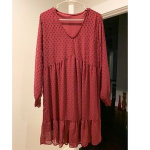 Long sleeve maroon dress. Knee high flow dress. Has never been worn.